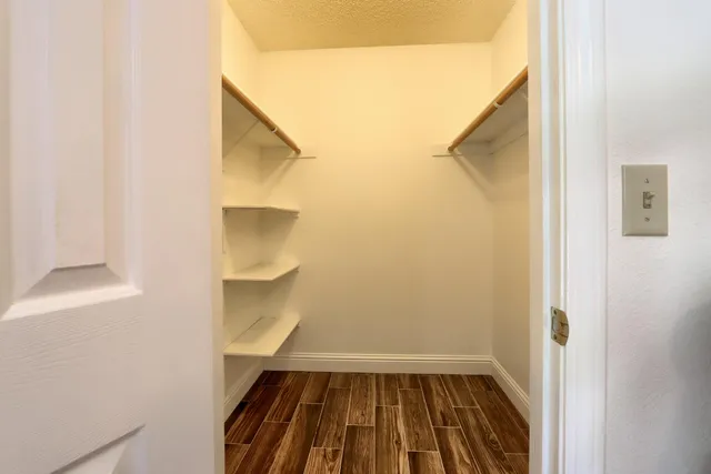 a bathroom with a sink a toilet and a large mirror