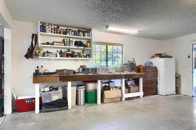 a view of an empty room with storage & utility room