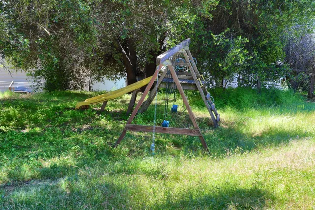 an aerial view of residential house with outdoor space