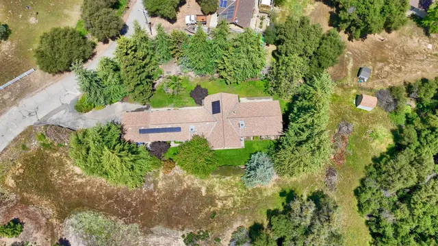 a view of a house with a tree