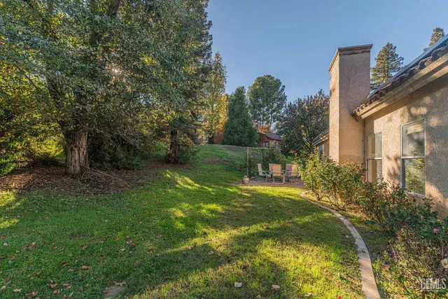 a swimming pool with some trees in the background