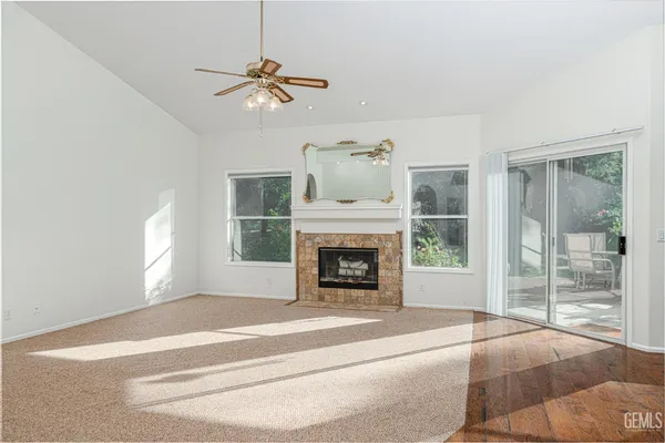 a bedroom with a bed and a fireplace