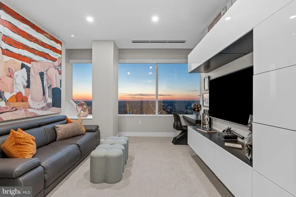 a view of a room with window and furniture