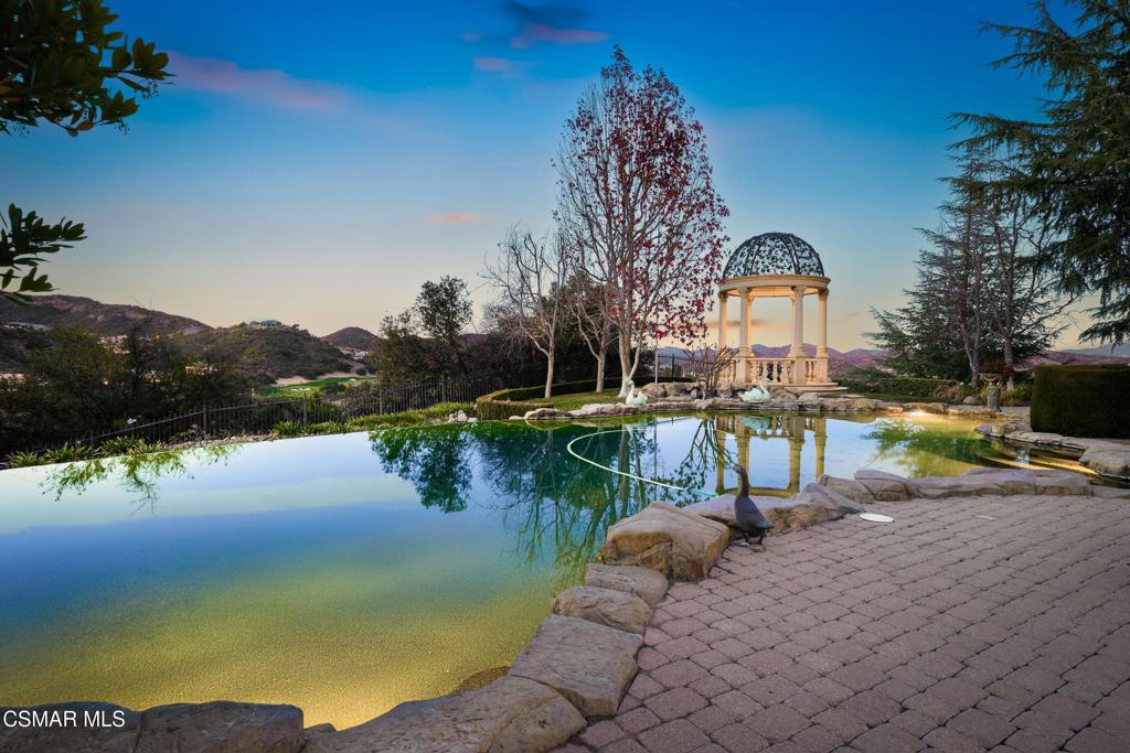 900 West Stafford Road Thousand Oaks, CA 91361 - Photo 13 of 73 a view of a lake with a house in the background