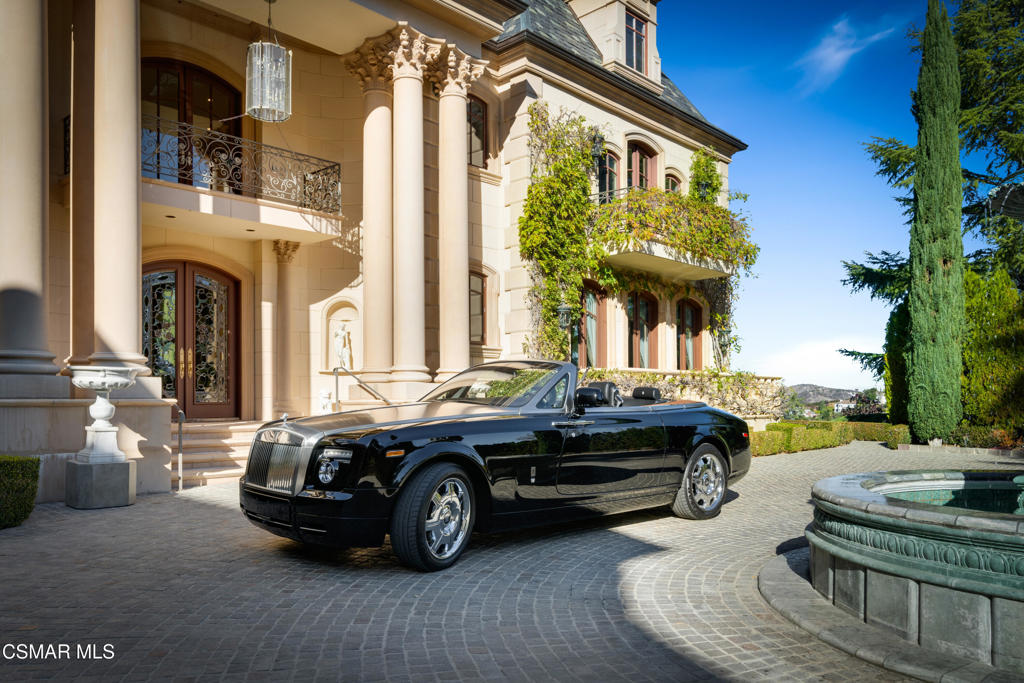 900 West Stafford Road Thousand Oaks, CA 91361 - Photo 18 of 73 a car parked in front of a brick house