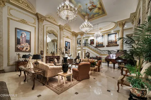 a bathroom with a sink a vanity a mirror and a bathtub