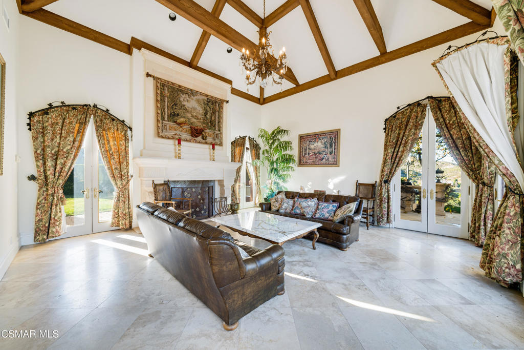 900 West Stafford Road Thousand Oaks, CA 91361 - Photo 70 of 73 a living room with furniture a fireplace and a flat screen tv