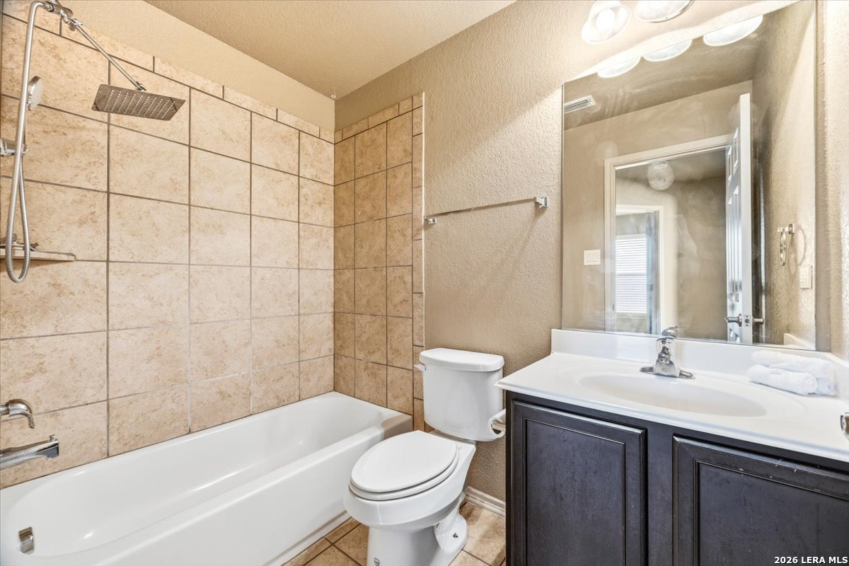 3831 Bacall Way Converse, TX 78109 - Photo 25 of 33 a bathroom with a sink a toilet and shower