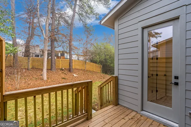 a view of a balcony with wooden floor