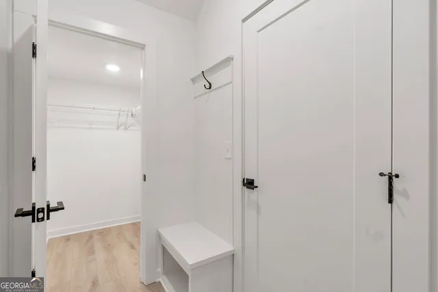 a bathroom with a shower and a sink