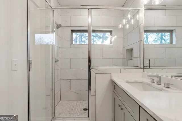a bathroom with a sink and a mirror