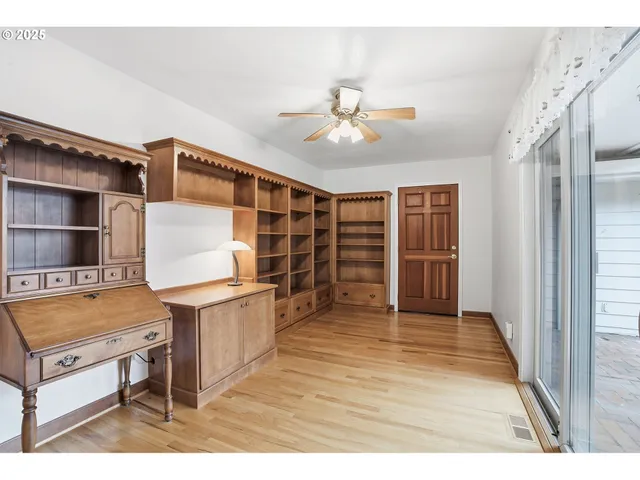 a view of a livingroom with furniture and staircase