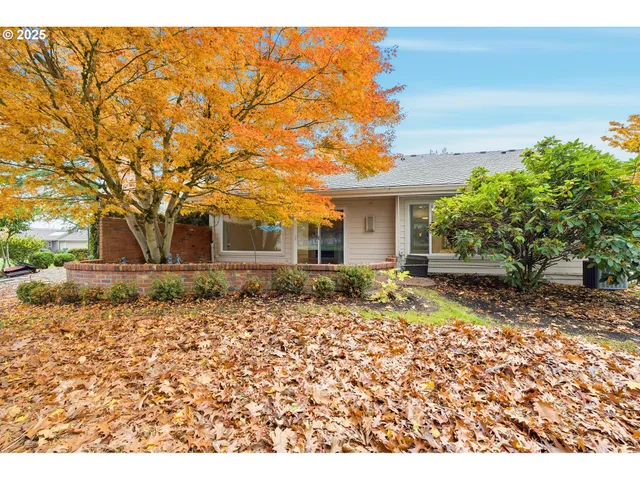 a view of a house with sitting area and garden