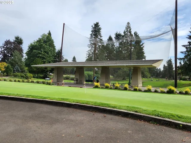 a living room with couches and a coffee table with wooden floor