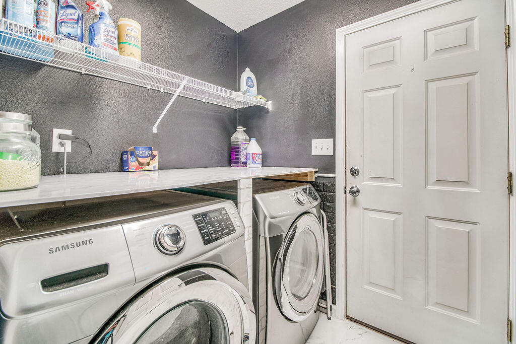 2442 Raider Lane Navarre, FL 32566 - Photo 20 of 46 a utility room with dryer and washer