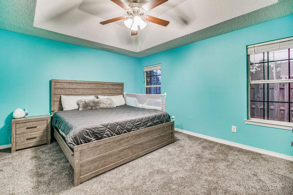 2442 Raider Lane Navarre, FL 32566 - Photo 22 of 46 a bedroom with a large bed and a window