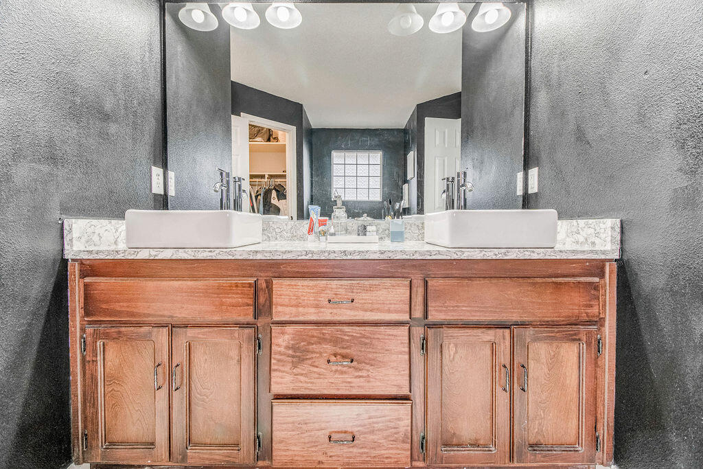 2442 Raider Lane Navarre, FL 32566 - Photo 25 of 46 a view of granite countertop cabinets