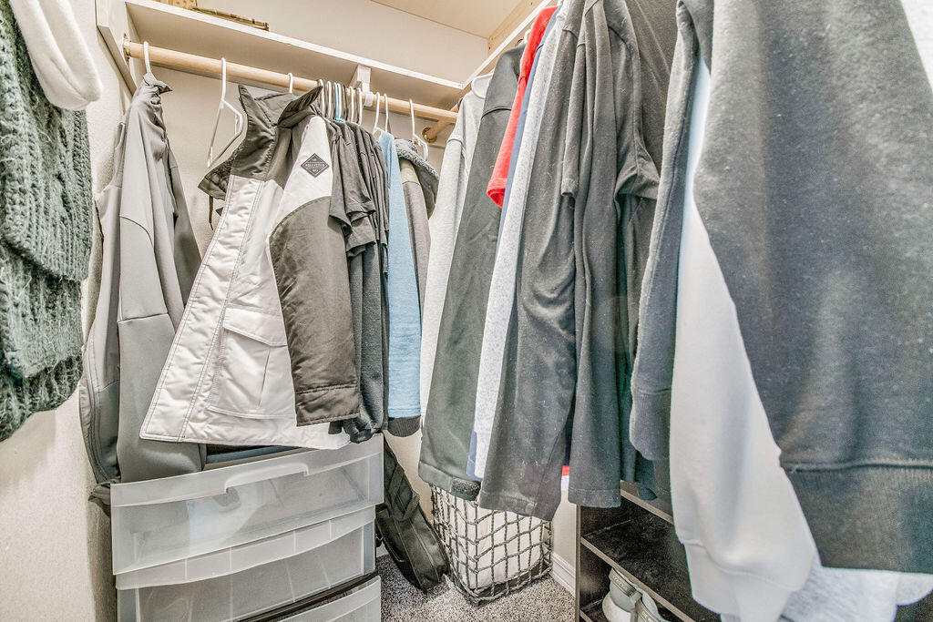 2442 Raider Lane Navarre, FL 32566 - Photo 30 of 46 a view of walk in closet with clothes
