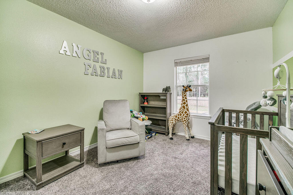 2442 Raider Lane Navarre, FL 32566 - Photo 33 of 46 a living room with furniture and wooden floor