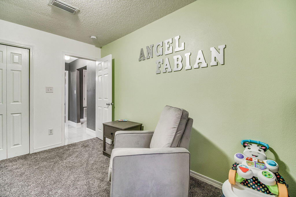 2442 Raider Lane Navarre, FL 32566 - Photo 34 of 46 a bedroom with a bed and cabinets