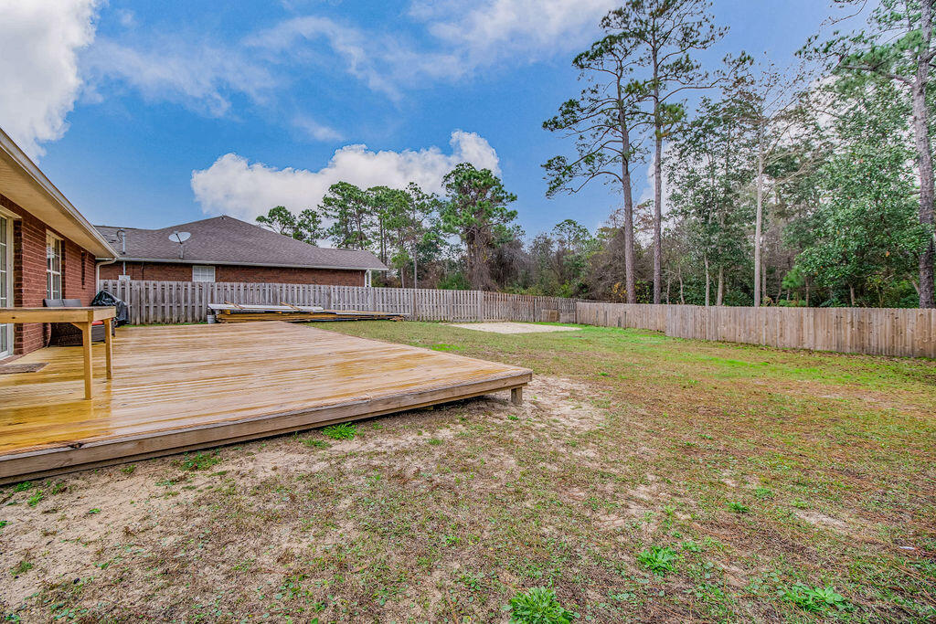 2442 Raider Lane Navarre, FL 32566 - Photo 42 of 46 a view of a backyard