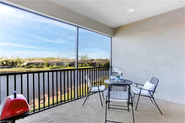 a view of a balcony with furniture