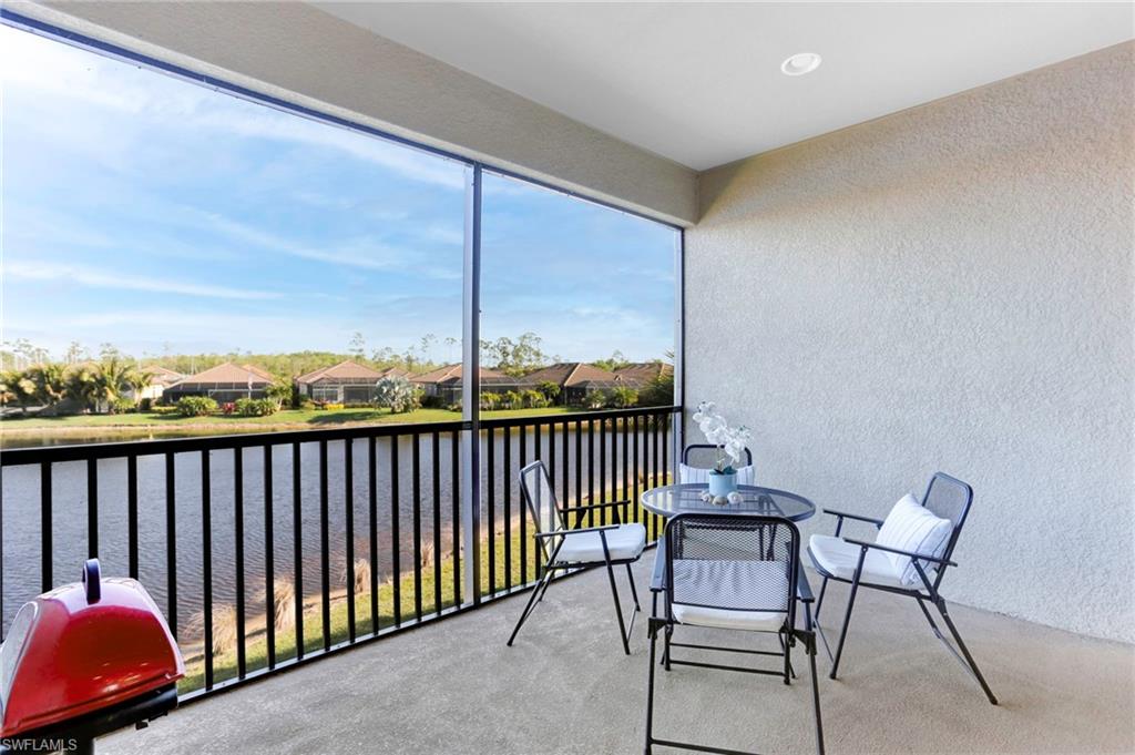 9433 Benvenuto Court, Unit 201 Naples, FL 34119 - Photo 19 of 32 a view of a balcony with furniture