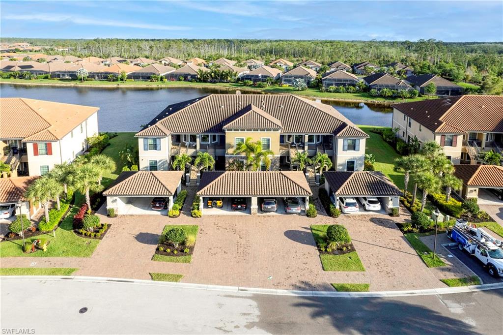 9433 Benvenuto Court, Unit 201 Naples, FL 34119 - Photo 23 of 32 an aerial view of a house with a garden