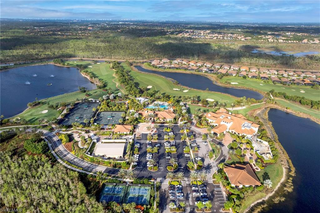 9433 Benvenuto Court, Unit 201 Naples, FL 34119 - Photo 28 of 32 a view of a lake with a city