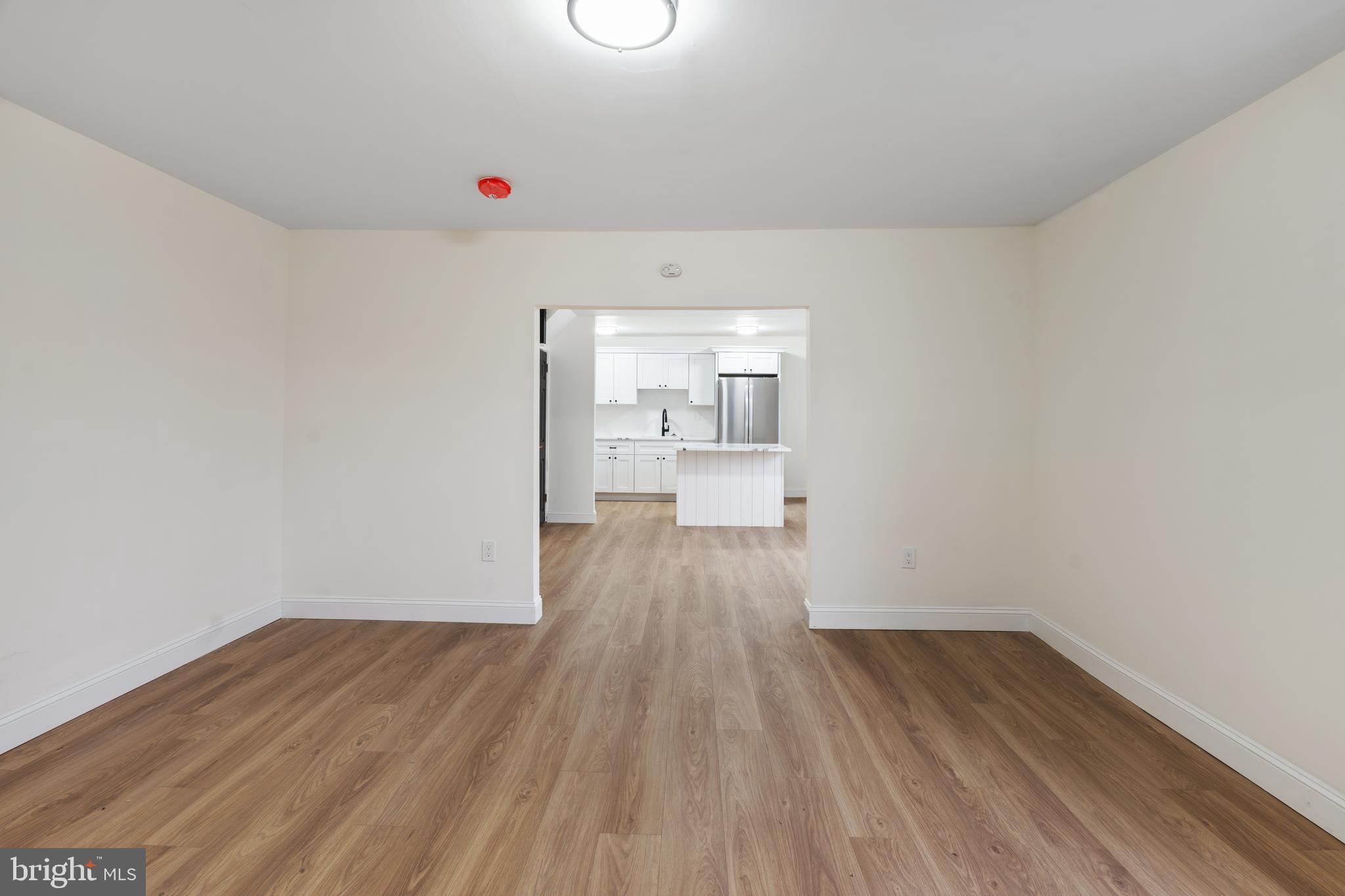 1118 Brown Street Chester, PA 19013 - Photo 12 of 27 a view of a room with wooden floor and window