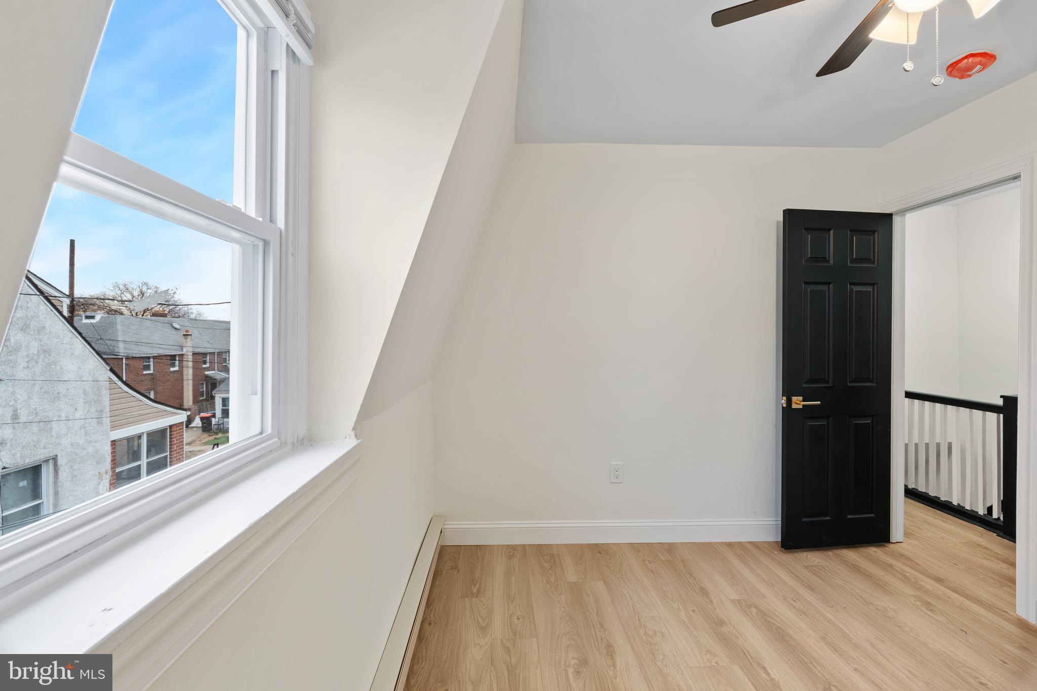 1118 Brown Street Chester, PA 19013 - Photo 17 of 27 wooden floor in an empty room