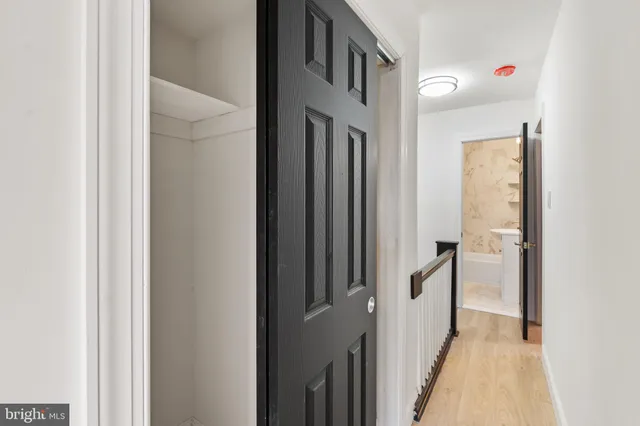 a view of a hallway with a white walls