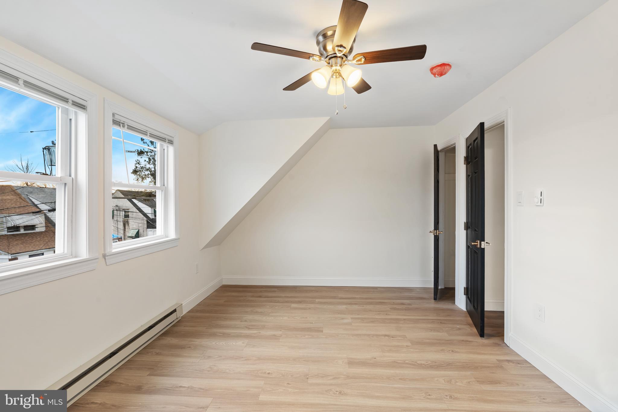 1118 Brown Street Chester, PA 19013 - Photo 25 of 27 wooden floor in an empty room with a window