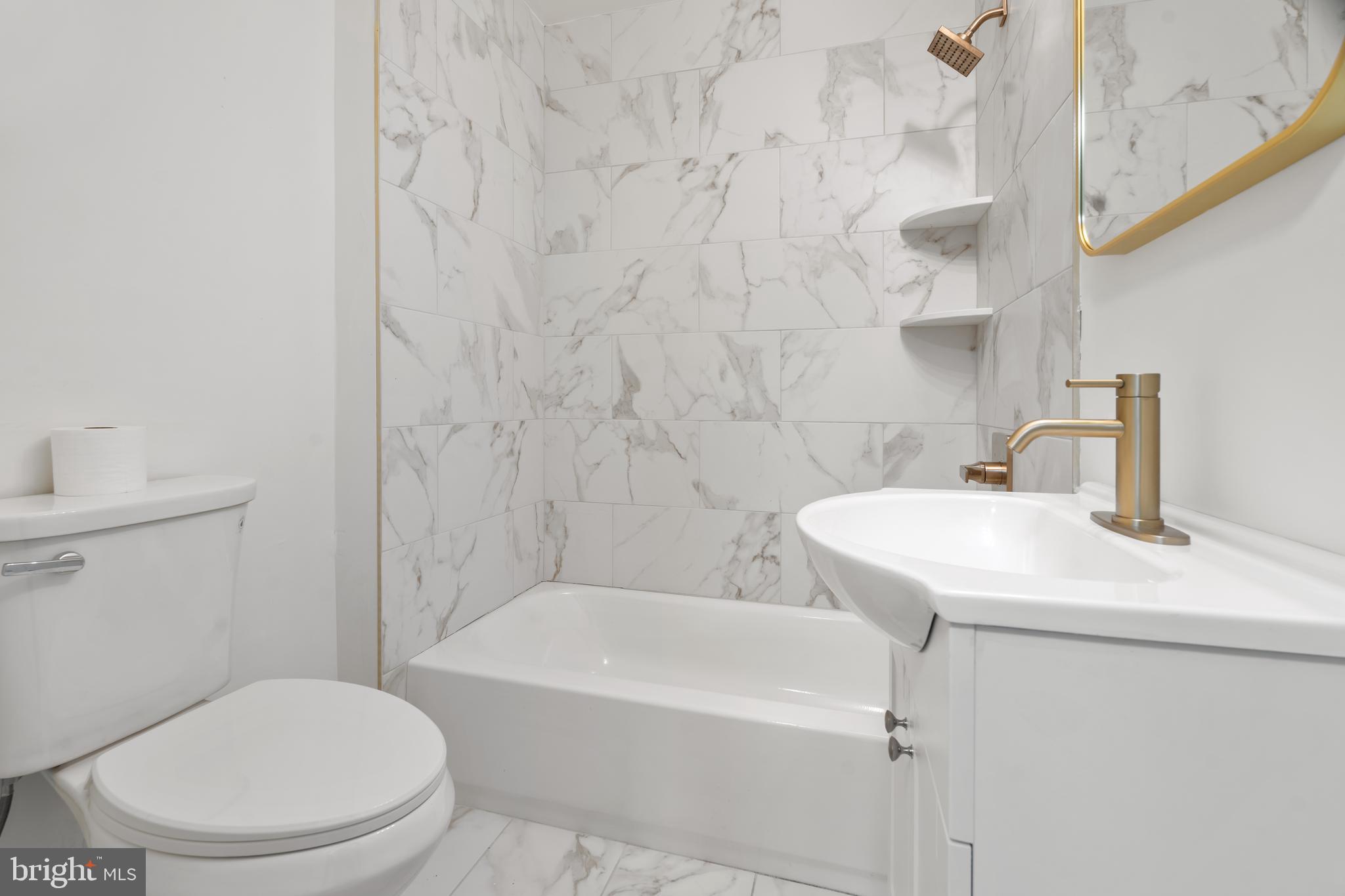 1118 Brown Street Chester, PA 19013 - Photo 7 of 27 a bathroom with a sink toilet and shower