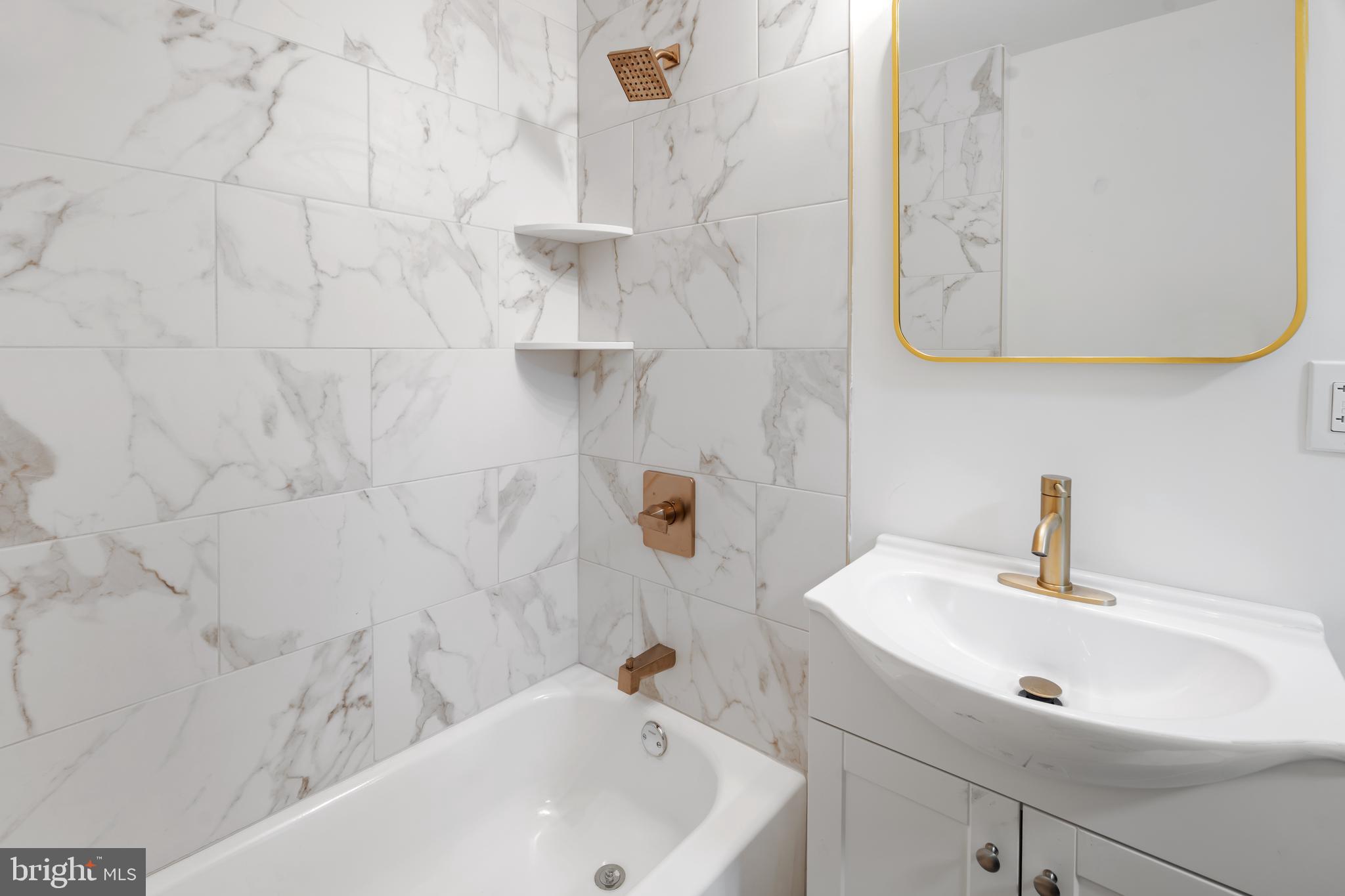 1118 Brown Street Chester, PA 19013 - Photo 8 of 27 a bathroom with a sink a mirror and shower