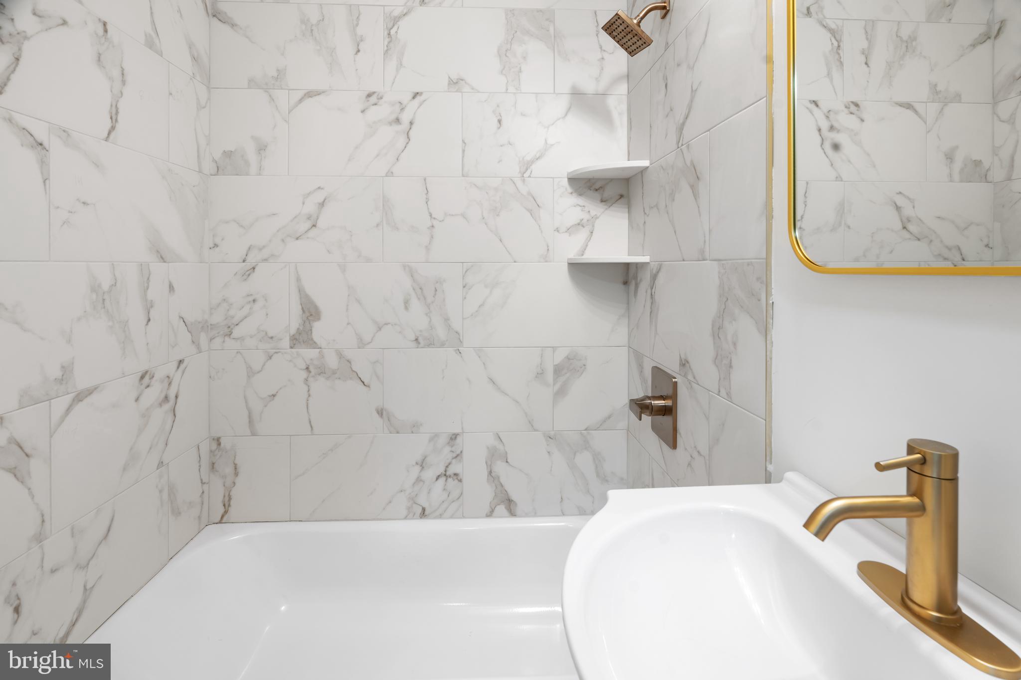 1118 Brown Street Chester, PA 19013 - Photo 9 of 27 a bathroom with a bathtub and a shower