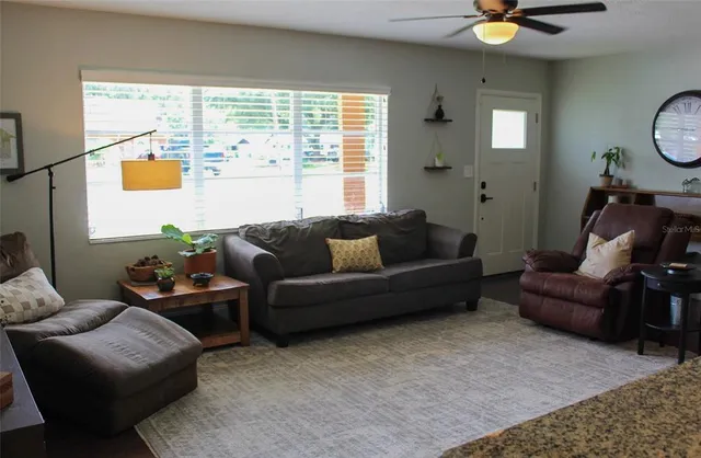 a living room with furniture and a window