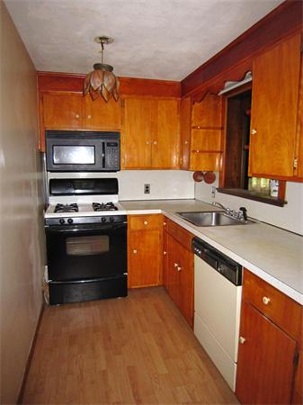137 Virginia Road Waltham, MA 02453 - Photo 7 of 13 a kitchen with stainless steel appliances a stove and a sink