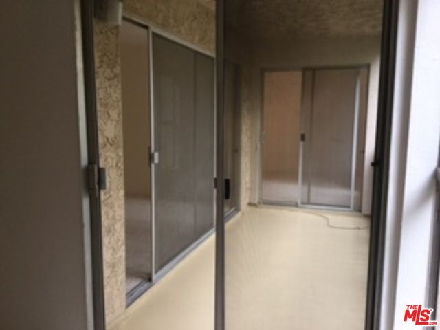 a bathroom with a glass shower door