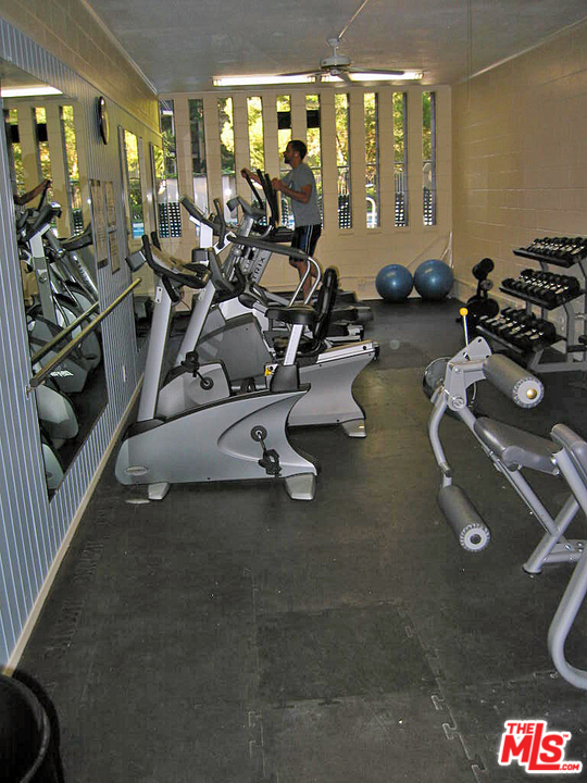 3110 Raintree Circle Culver City, CA 90230 - Photo 3 of 14 a room with gym equipment and large mirror