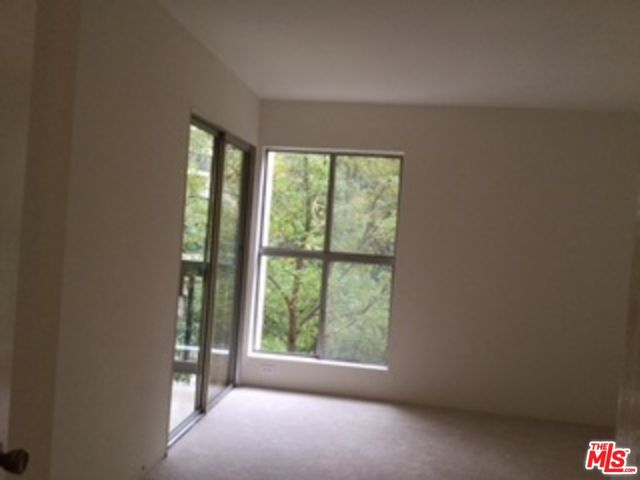 a view of a room that has a window in it