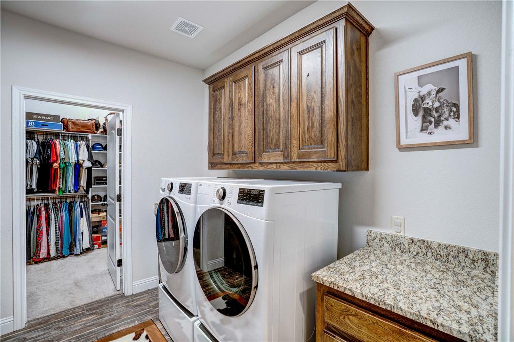 1355 Jay Bird Road Springtown, TX 76082 - Photo 21 of 40 a utility room with dryer and washer