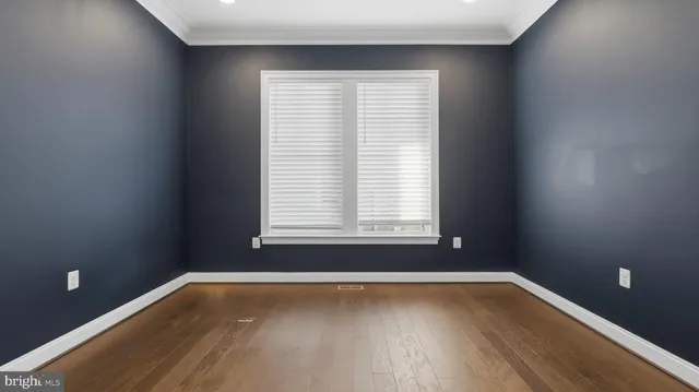 a kitchen with stainless steel appliances kitchen island granite countertop a refrigerator and a sink