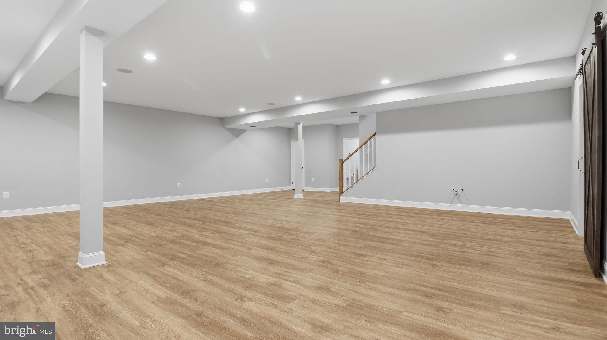 25956 Cullen Run Place Aldie, VA 20105 - Photo 93 of 109 a view of an empty room with wooden floor