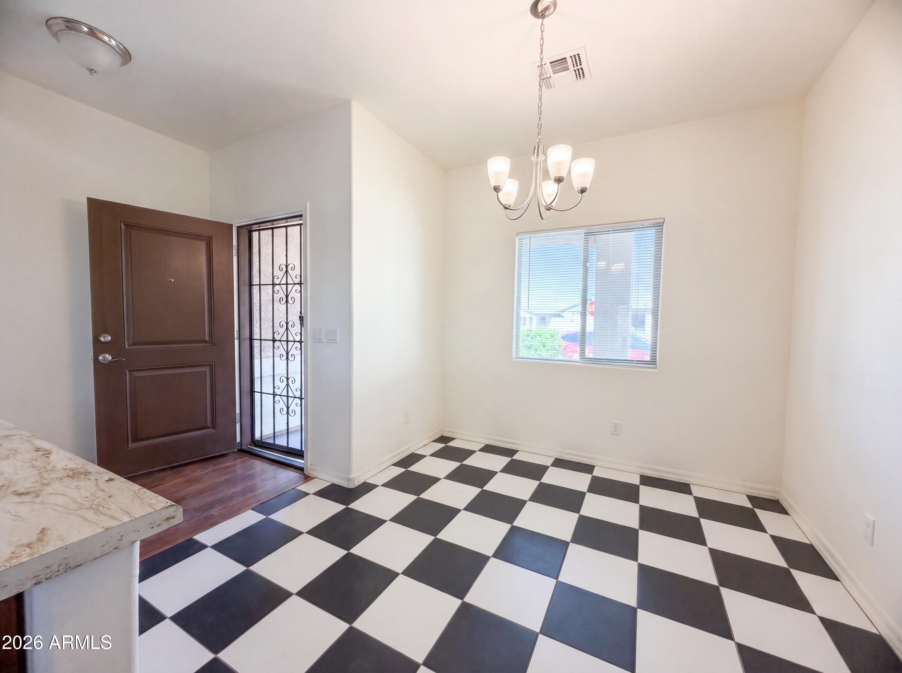 1738 South Aryelle Road Apache Junction, AZ 85119 - Photo 6 of 17 a view of a bedroom with wooden floor and a window
