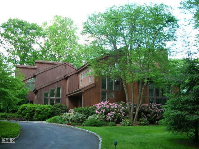 971 Sunset Road Stamford, CT 06903 - Photo 1 of 1 a house that has a tree in front of it