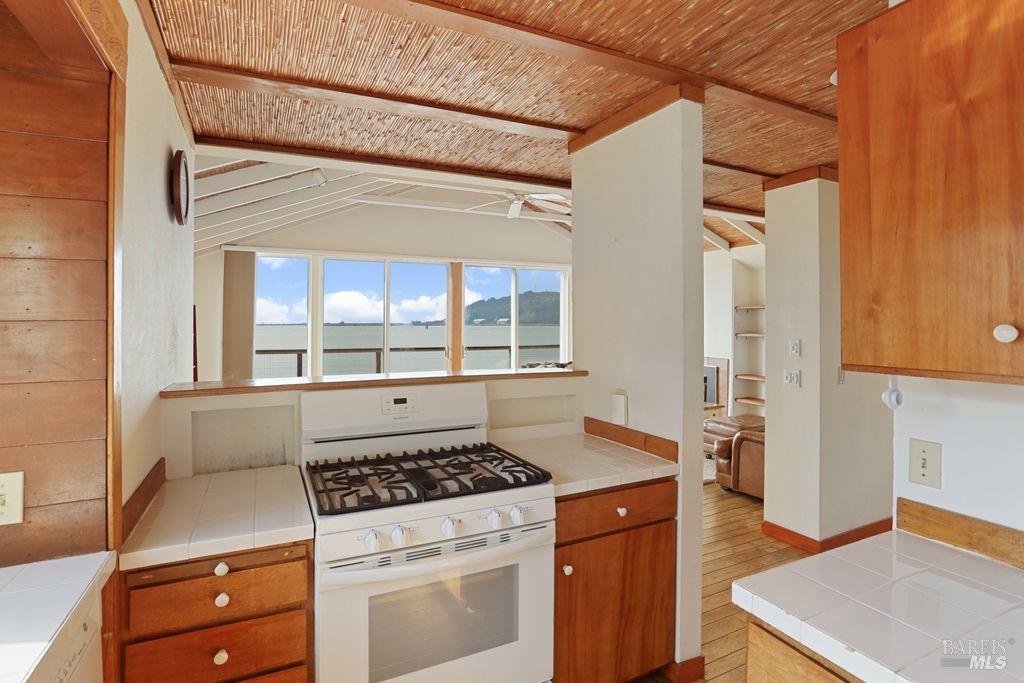 34 Sandy Beach Road Vallejo, CA 94590 - Photo 28 of 63 a kitchen with a stove and a refrigerator