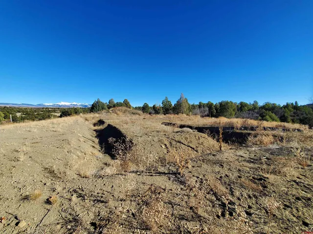 a view of lake with sunset