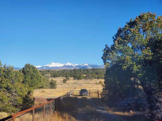 a view of a lake with houses in the background