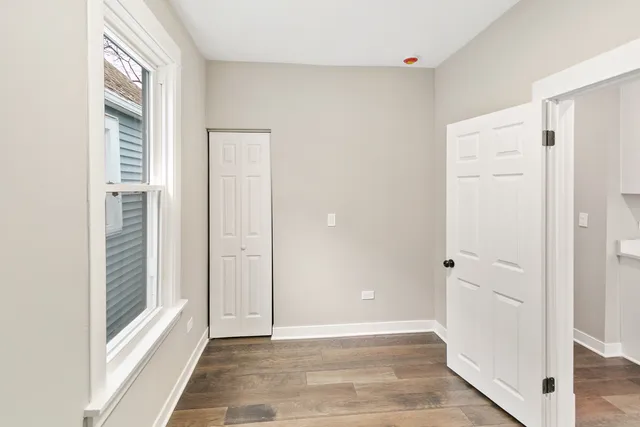 a bedroom with bed and wall painting